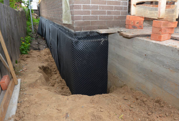Happy homeowners after waterproofing job in Paoli